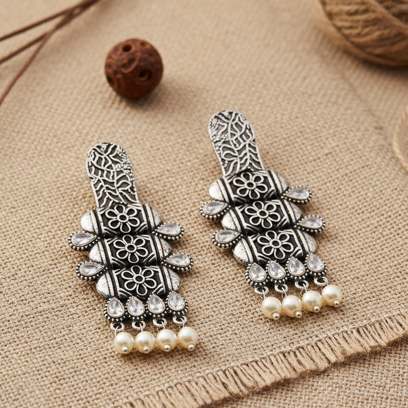 ManiStambh – Silver Brass Oxidised Dangler Earrings (White)