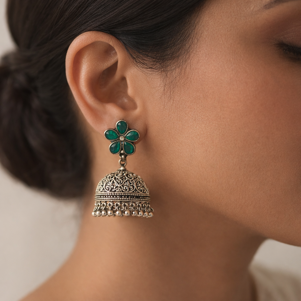 Champika- Silver Brass Stone-Studded Jhumka Earrings(Green)