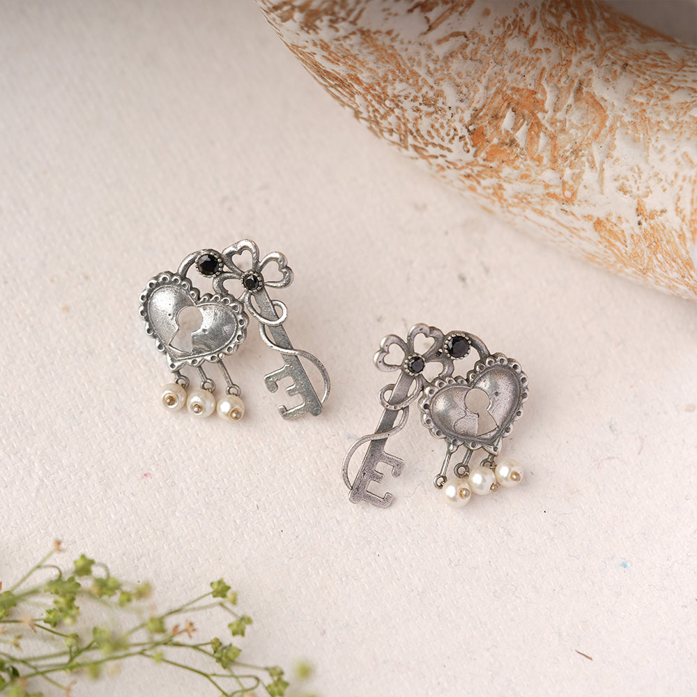 Kunjika- Silver Brass Oxidised Stud Earrings(Black)