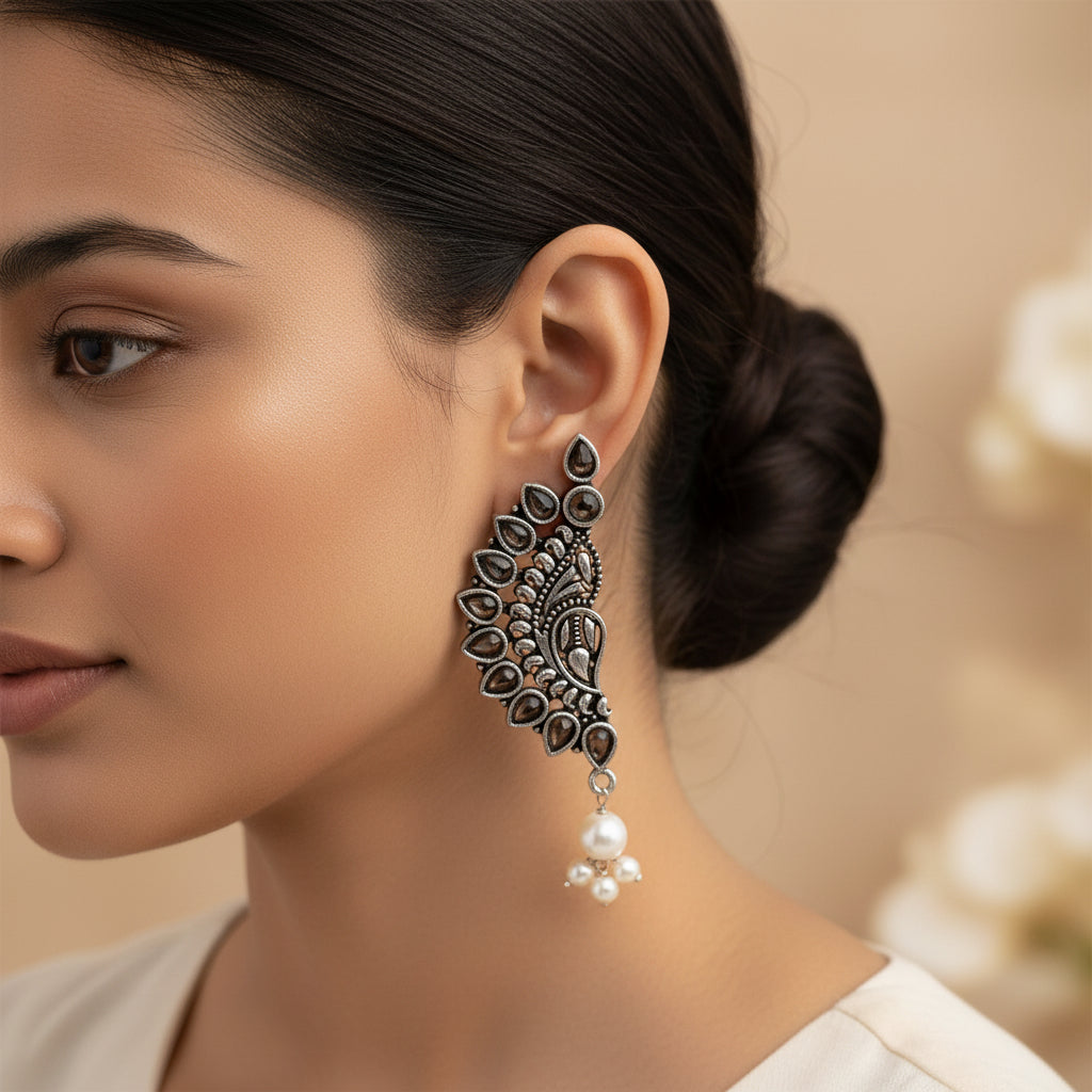 Traditional twirls- Handing pearl oxidised stud earrings