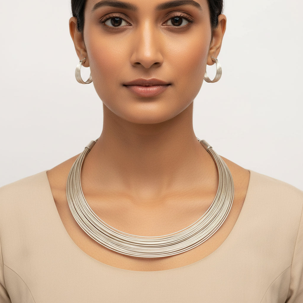 Hemaprabha- Multistrand Brass polished Hasli with Earrings & Adjustable Ring