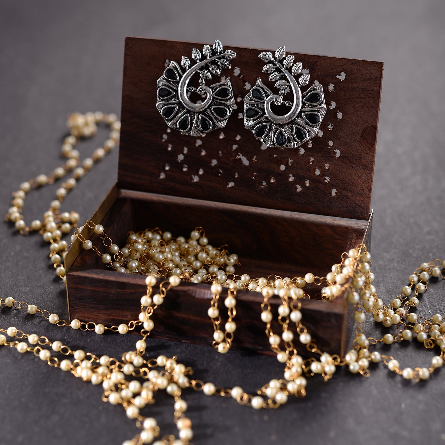 Peacock pearl- Stone syudded peaccock shaped studs earring