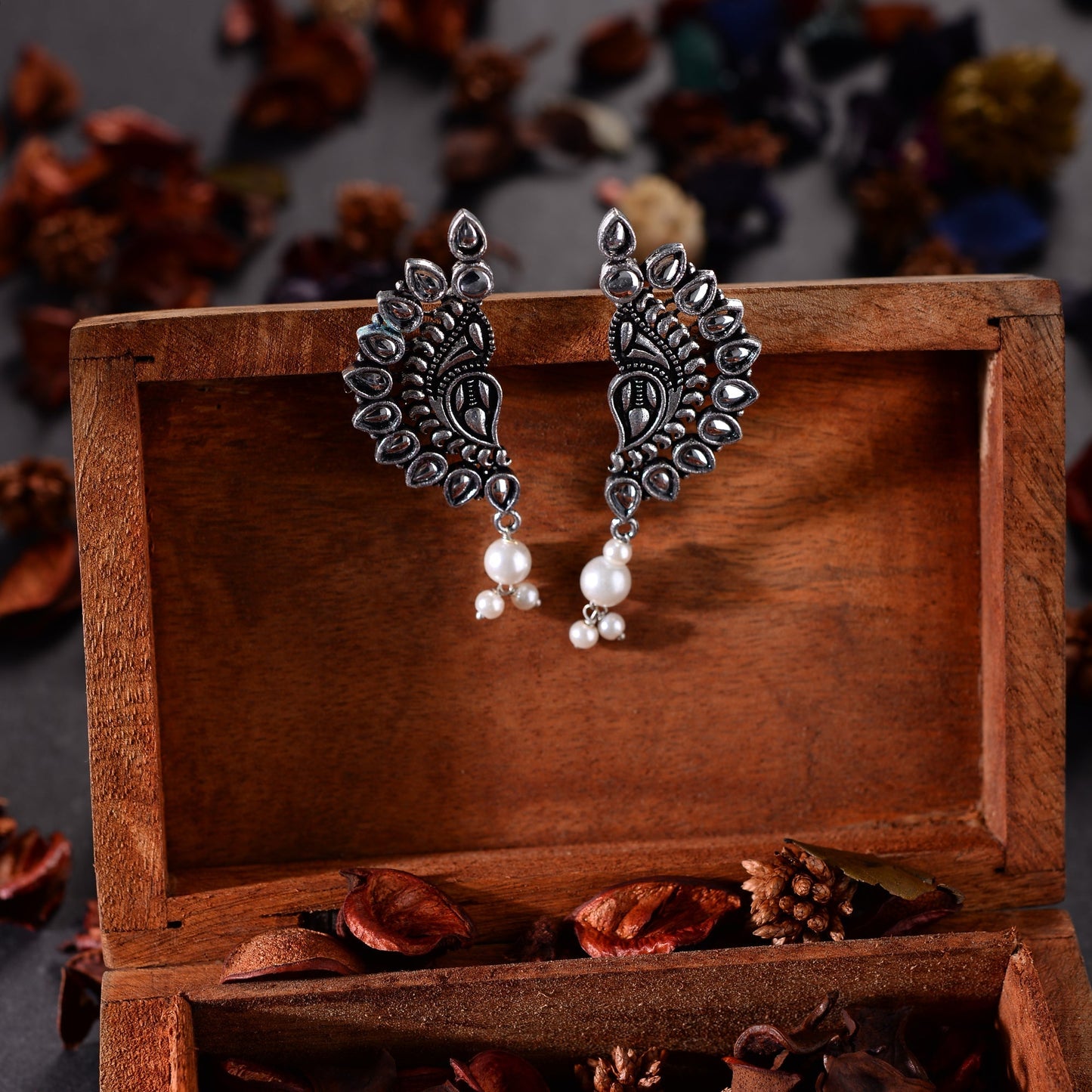 Traditional twirls- Handing pearl oxidised stud earrings