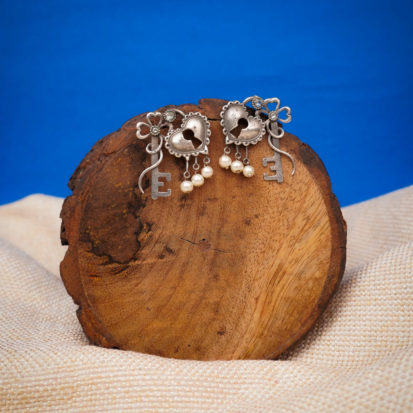 Kunjika- Silver Brass Oxidised dangler earrings (White)